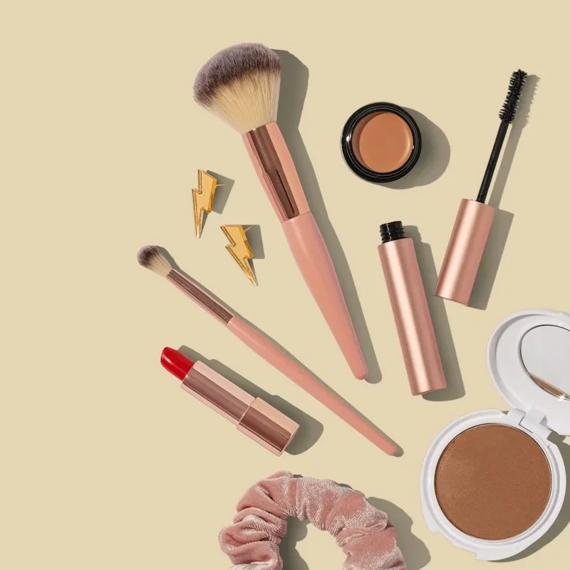 Photorealistic concept display of makeup palette and soft cosmetic brushes